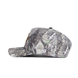 A side view of the Georgia Tech Outland Hat by No Rivals, an officially licensed snapback with a woodland camo pattern, embroidered details, and brown front patches, displayed against a white background.