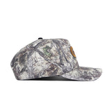 The Georgia Tech Outland Hat by No Rivals is a structured fit snapback with a flat brim, brown patch on the front, and features a woodland camo pattern with branch and leaf designs.
