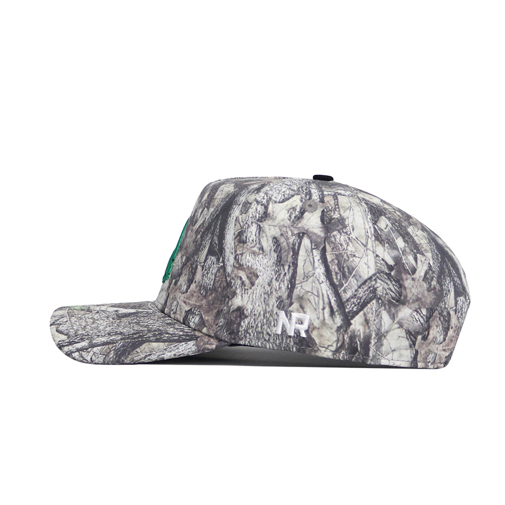 The No Rivals North Texas Outland Hat features a gray camo pattern, flat brim, snapback closure, and structured fit. "NR" is embroidered in white on high-quality cotton for comfort and durability. Shown from the side.