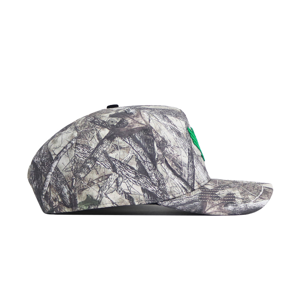 A side view of the No Rivals North Texas Outland Hat, a flat-brim snapback with gray and brown camo, green front embroidery, and a structured fit for lasting style and comfort.