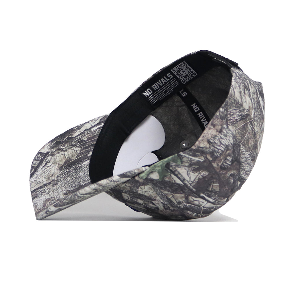 The Creighton Outland Hat by No Rivals is a camouflage structured fit cap made from high-quality cotton, with a curved brim for comfort. The inner band is labeled NO RIVALS and features black trim.