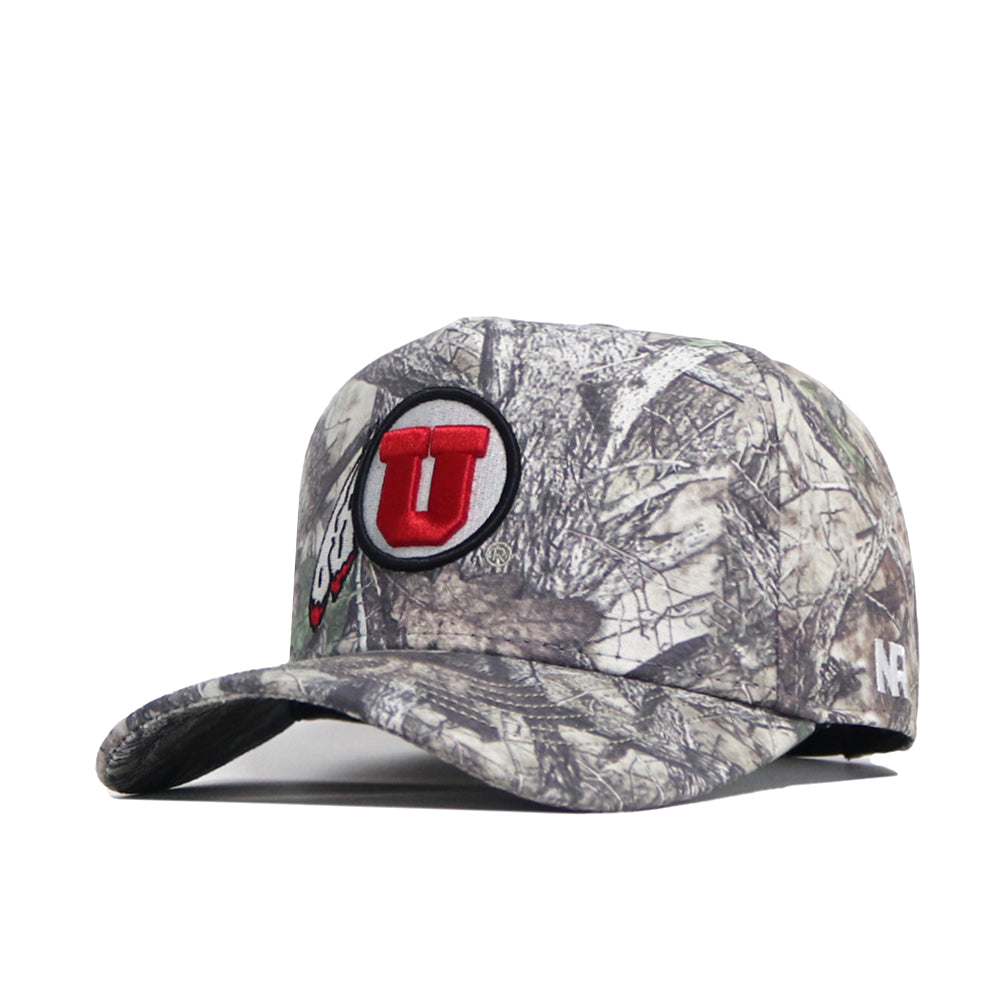 The No Rivals Utah Outland Hat is an officially licensed camo baseball cap with a red U logo outlined in black on the front and a small NE stitched on the side.