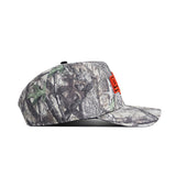 The No Rivals Oklahoma State Outland Hat features a camouflage cotton design with a structured fit, flat brim, and orange embroidery on the front. Shown in side profile, this snapback cap is set against a white background.