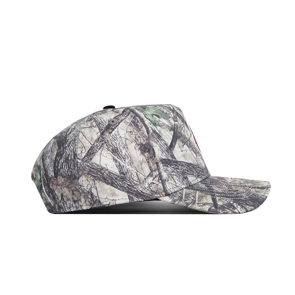 Side view of the No Rivals Louisville Outland Hat, a snapback baseball cap featuring a green, brown, and beige camouflage pattern. Made from high-quality cotton and shown isolated on a white background.