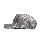 The No Rivals Texas State Outland Hat is a side-view camouflage baseball cap in brown, green, and gray cotton, featuring a structured fit, curved brim, and a small white embroidered logo near the back.