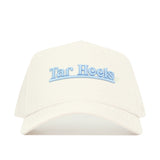The No Rivals North Carolina Sideline Hat is a white snapback made from high-quality cotton, featuring "Tar Heels" embroidered in light blue on the front for a structured fit.