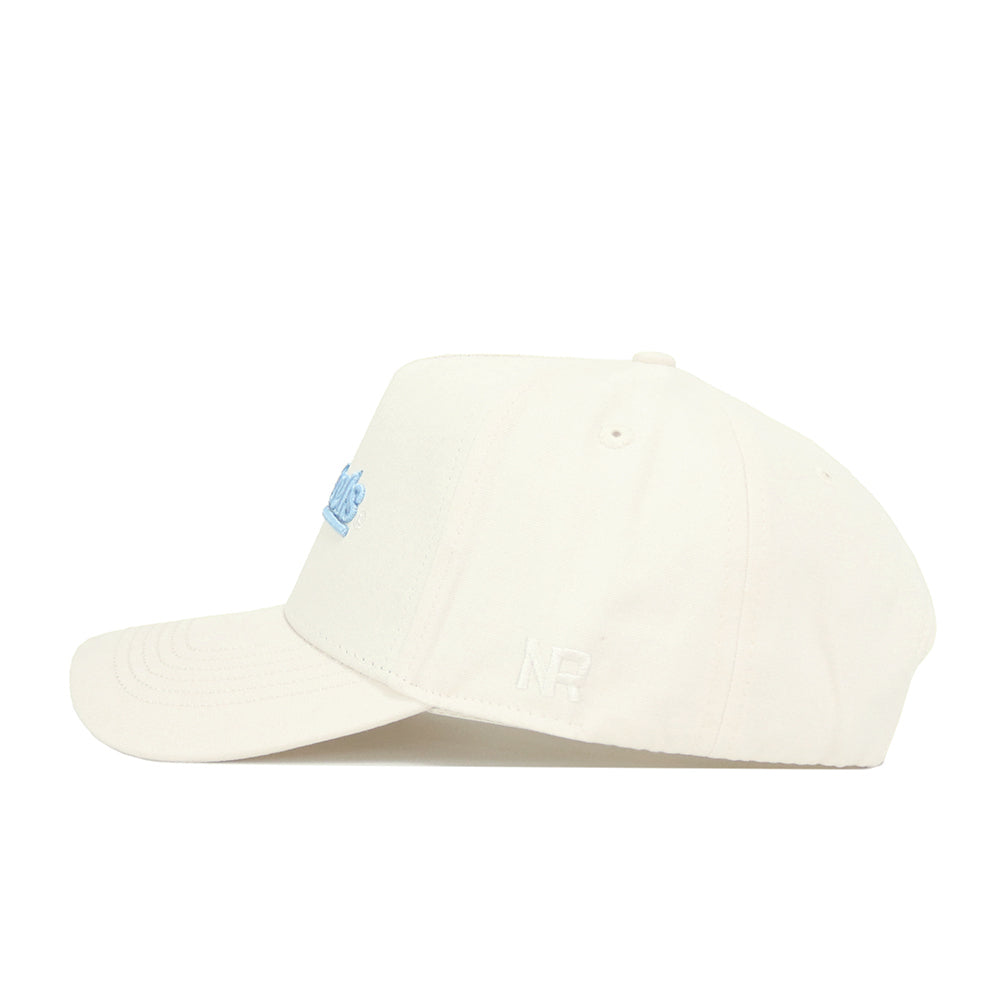 The No Rivals North Carolina Sideline Hat is a cream snapback made from high quality cotton, featuring light blue embroidered lettering on the front and white NR initials stitched on the side. The structured cap is shown in side view on a white background.