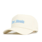 The North Carolina Sideline Hat by No Rivals is a cream baseball cap with "Tar Heels" embroidered in light blue on the front. Made from high quality cotton, it features a structured fit, curved brim, and structured crown for comfort and style.