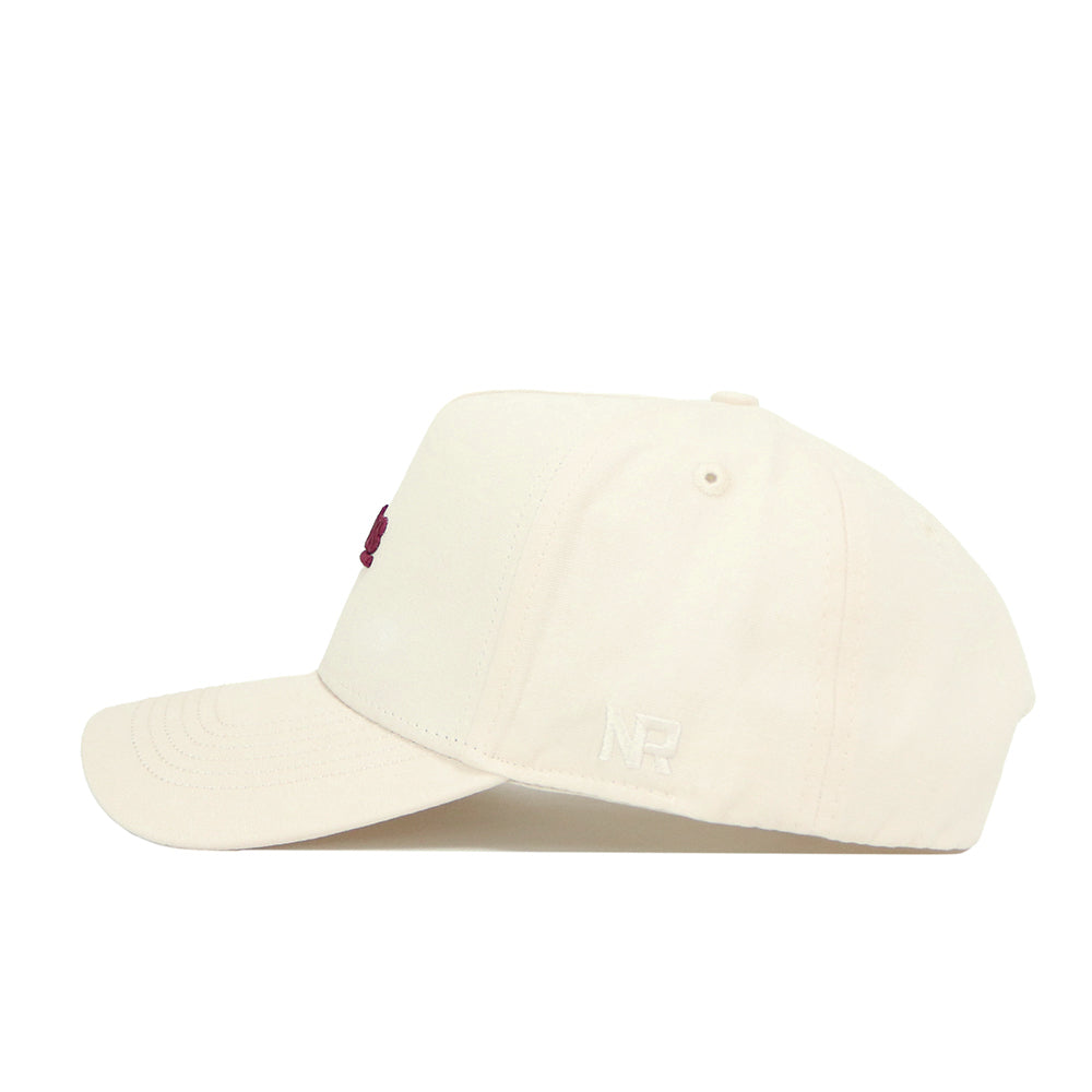 The No Rivals Florida State Sideline Hat is a cream-colored, structured cotton baseball cap. Seen from the side, it has subtle stitching on the brim and minimal embroidery, including a small white logo near the back.