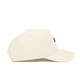 The No Rivals Florida State Sideline Hat is a structured off-white baseball cap with a curved brim, minimal design, and a small patch of red stitching on the front, shown in profile facing right.