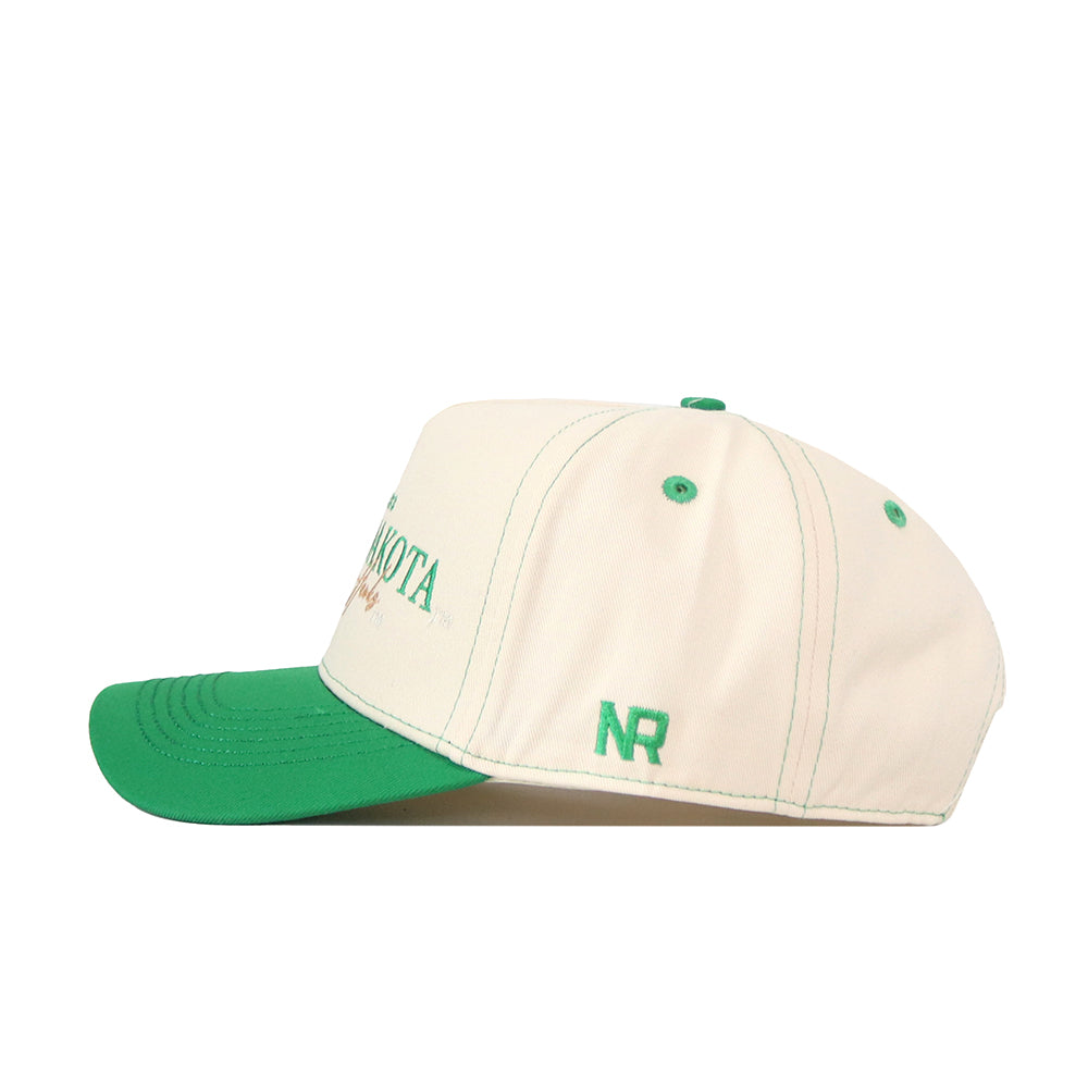 Introducing the North Dakota Vintage Hat by No Rivals—a white baseball cap with a green brim and green stitching, featuring an embroidered NR logo on the side. This officially licensed hat offers a convenient snapback closure for an adjustable fit.