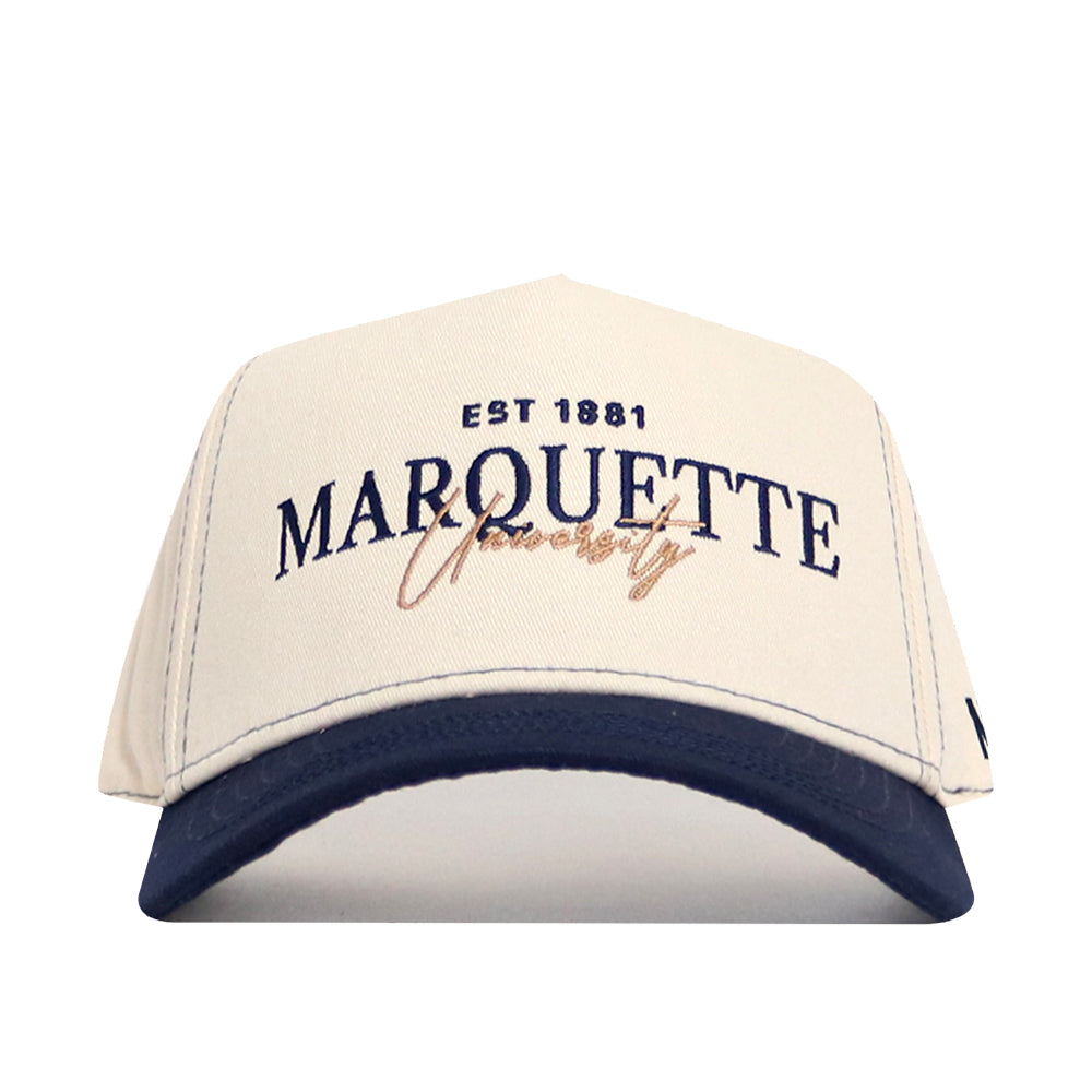 The No Rivals Marquette Vintage Hat is a cream cotton baseball cap with "EST 1881 MARQUETTE University" embroidered in navy and gold, a navy blue brim, and a comfy snapback closure.