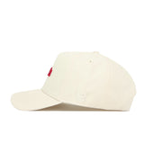 The No Rivals Georgia Sideline Hat is a beige cotton baseball cap with red embroidered letters on the front and white "NR" on the side, displayed in side profile on a plain white background.