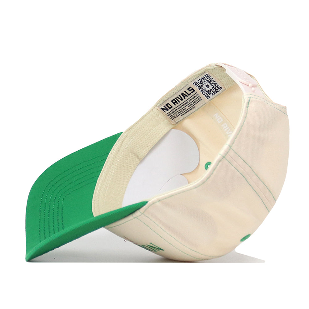 North Dakota Vintage Hat by No Rivals shown inside out, revealing the inner tag with NO RIVALS text and a visible QR code. The snapback cap features a beige crown with green stitched details, a green brim, and an embroidered logo for a premium, officially licensed finish.