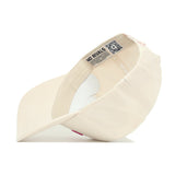 The No Rivals Georgia Sideline Hat is a light beige, high-quality cotton baseball cap shown from the underside, displaying a fabric strap and an interior label with text and a QR code. The cap looks unworn and clean.