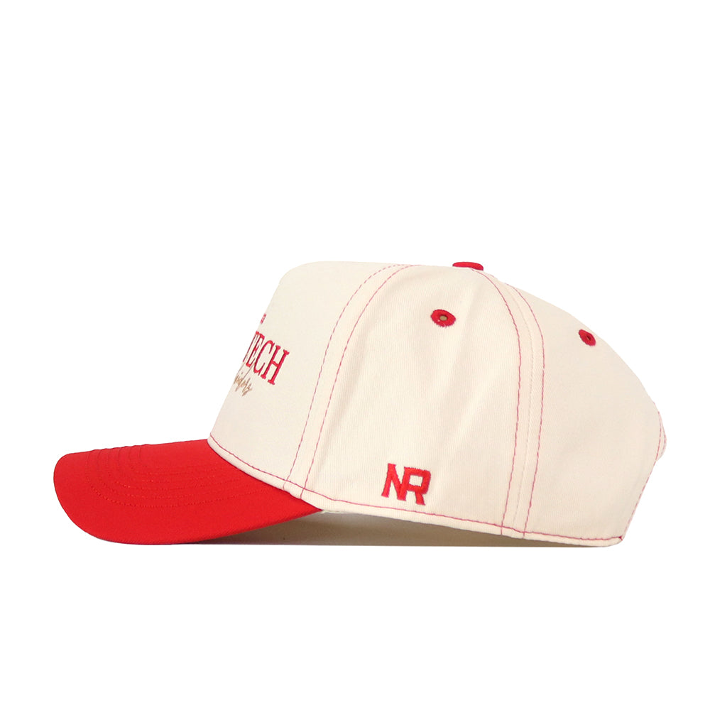 Introducing the Texas Tech Red Raiders Vintage Hat by No Rivals—a cream-colored baseball cap made from high-quality cotton. This snapback features a bold red brim, matching red stitching, and red embroidered “NR” lettering on the side. Shown in profile facing left, it’s the perfect No Rivals accessory to complete your gameday look.