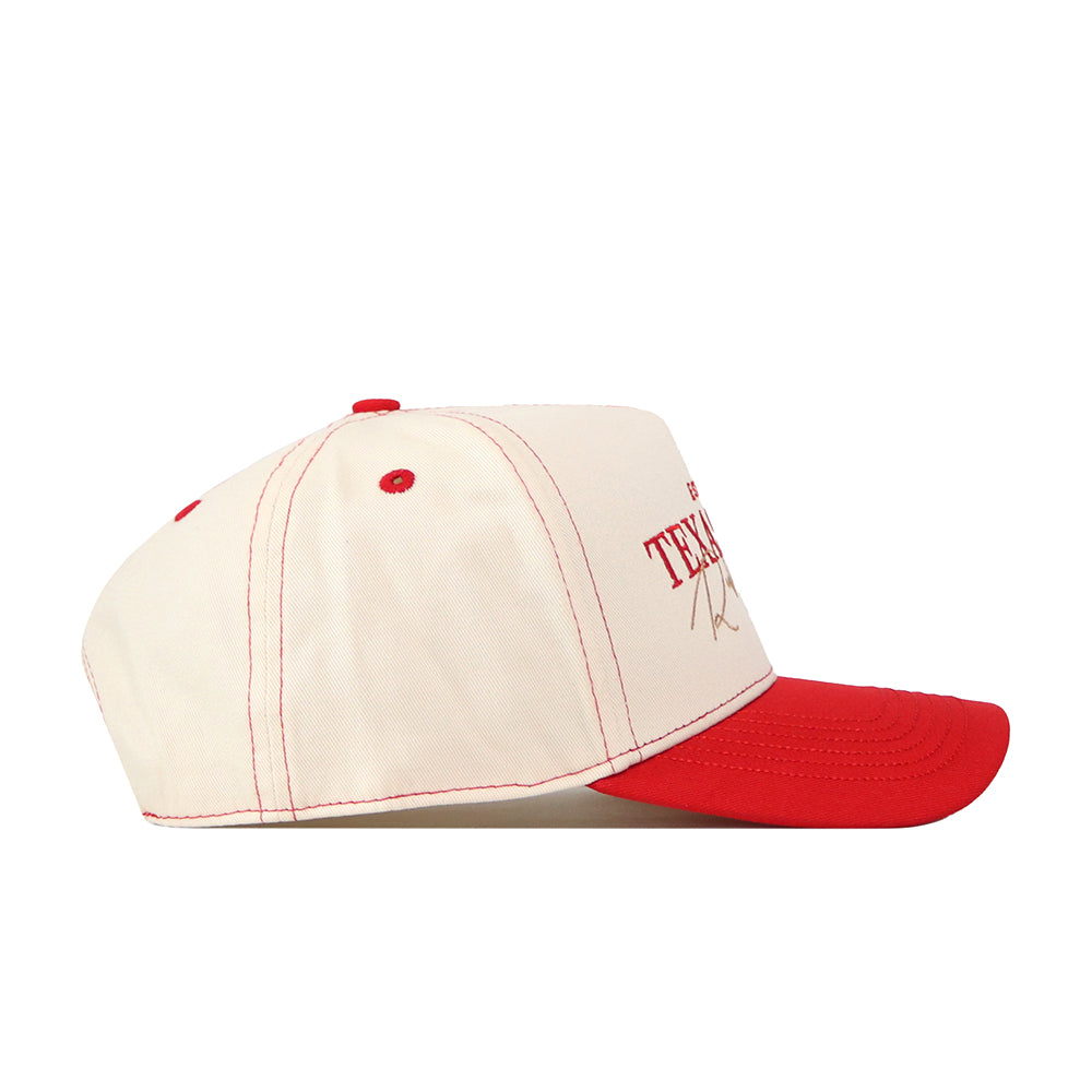 A cream-colored Texas Tech Red Raiders Vintage Hat by No Rivals, crafted from high quality cotton and detailed with red stitching, a red button on top, and a red brim. The side view reveals partial “TEX” lettering in red on the front—perfect for your next gameday look.