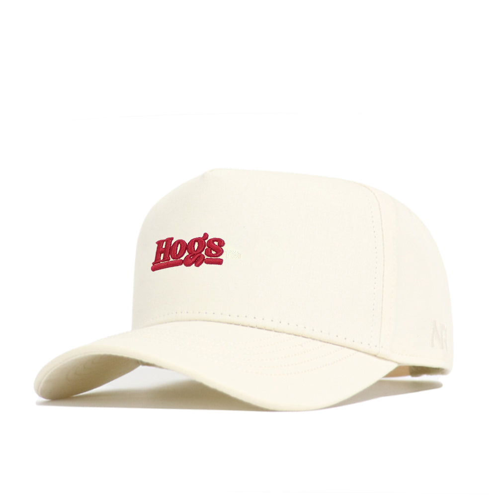 The No Rivals Arkansas Sideline Hat is a cream snapback made from high-quality cotton, featuring "Hogs" embroidered in red on the front, shown at an angle against a white background.