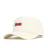 The No Rivals Arkansas Sideline Hat is a cream snapback made from high-quality cotton, featuring "Hogs" embroidered in red on the front, shown at an angle against a white background.