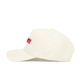 The Western Kentucky Sideline Hat by No Rivals is a cream snapback crafted from premium cotton, with red embroidery on the front and white NR initials on the side, displayed from a side angle against a white background.