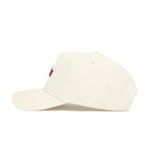 A side view of the No Rivals Virginia Tech Sideline Hat, an off-white high-quality cotton baseball cap with a small red embroidered front design, subtle stitched details, and a curved brim, set against a plain white background.