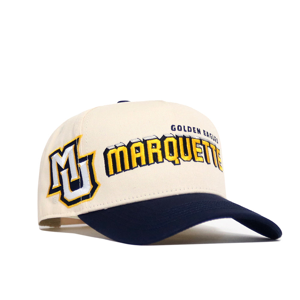 The No Rivals Marquette Alma Mater Hat is a cream and navy snapback baseball cap with the Golden Eagles logo and "Marquette" embroidered on the front, crafted from high-quality cotton and officially licensed.