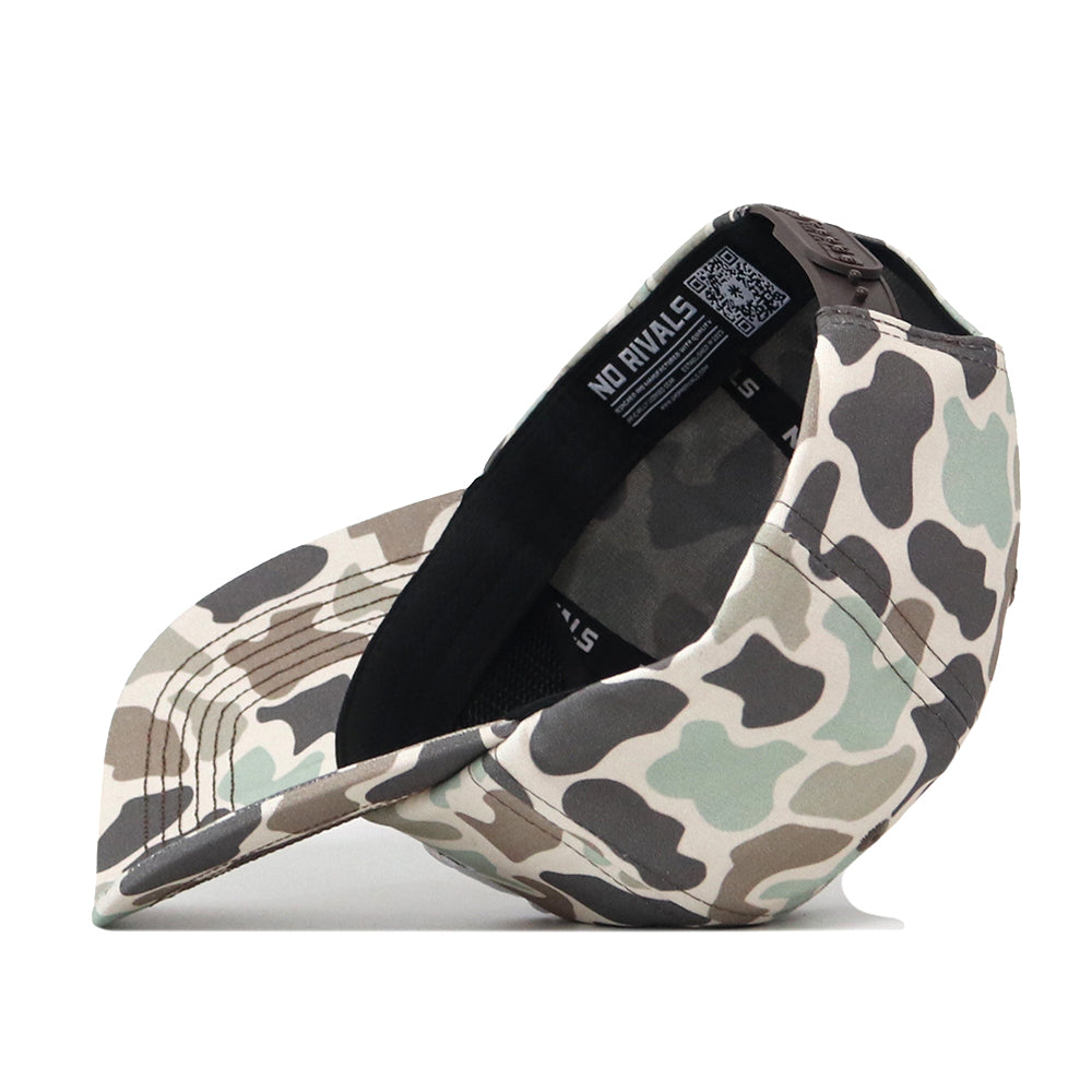 A Minnesota Gophers Huntsman Hat by No Rivals is displayed upside down, revealing the inside tag branded NO RIVALS. The hat showcases earth-tone camouflage colors—green, beige, and brown—and features a handy Snap Back Adjustment for the perfect gameday fit.