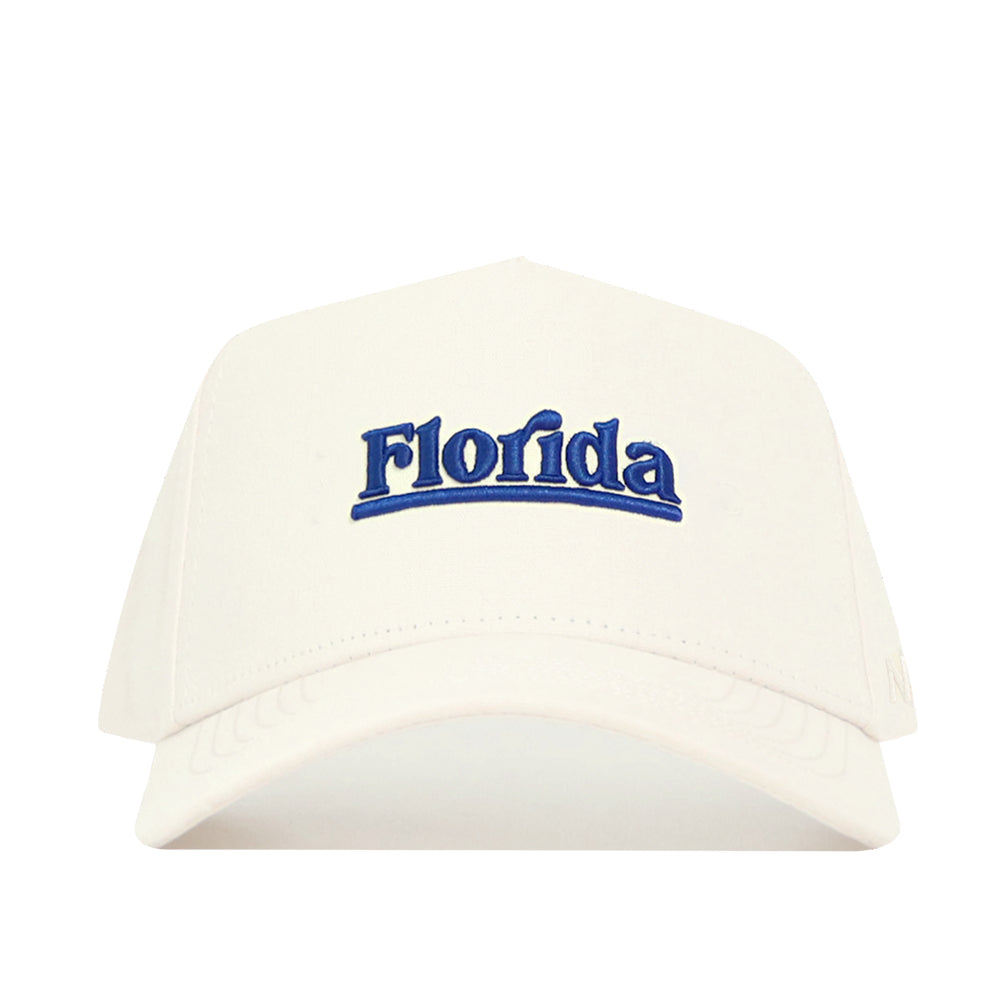 The No Rivals Florida Sideline Hat is a white cotton baseball cap with "Florida" embroidered in blue on the front and offers a structured fit.