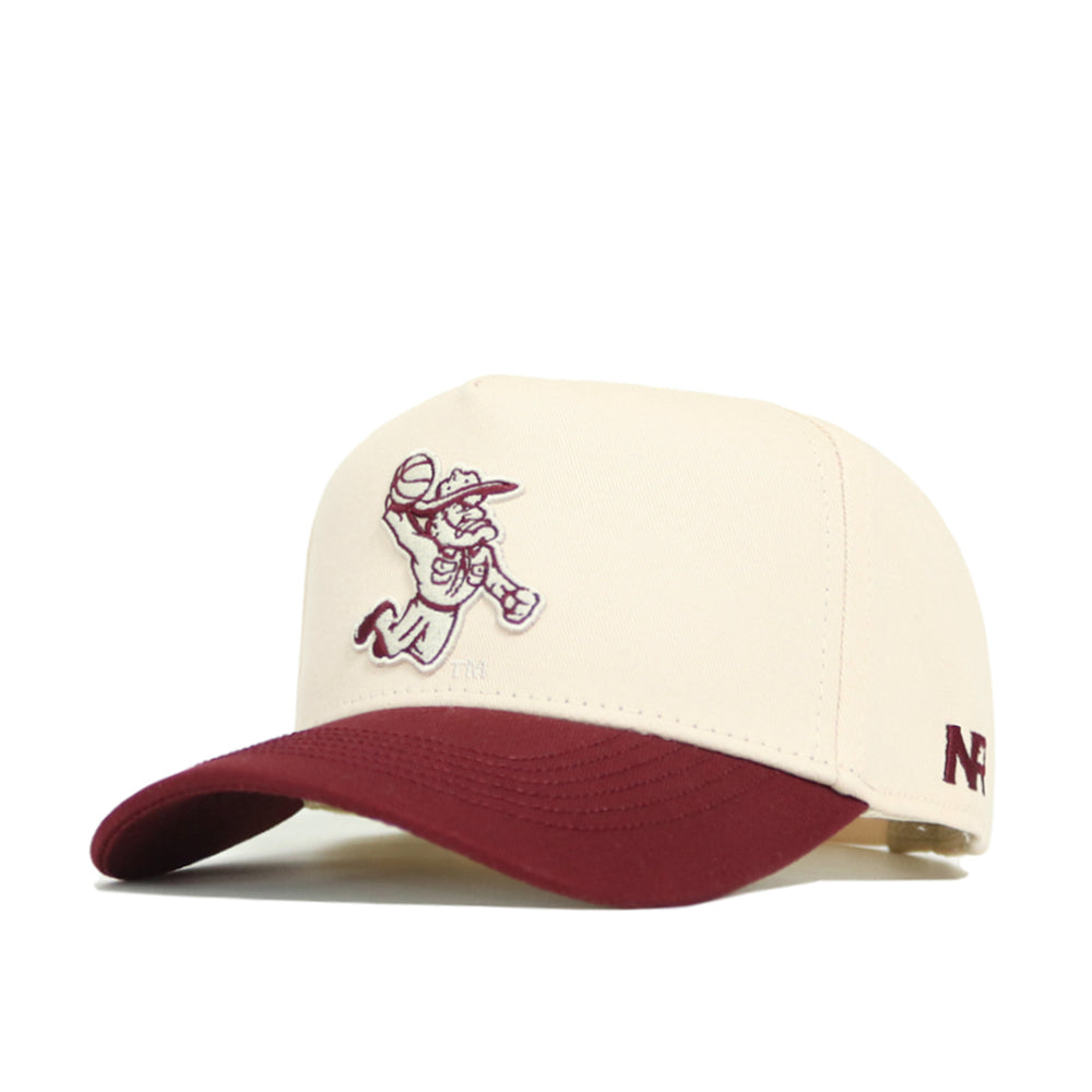 The Texas A&M Ol' Sarge Basketball Hat - Classic by No Rivals is a cream snapback with a maroon brim. It features an embroidered cartoon cowboy with a football on the front, "NF" on the side, and is made from a comfy polyester-cotton blend.
