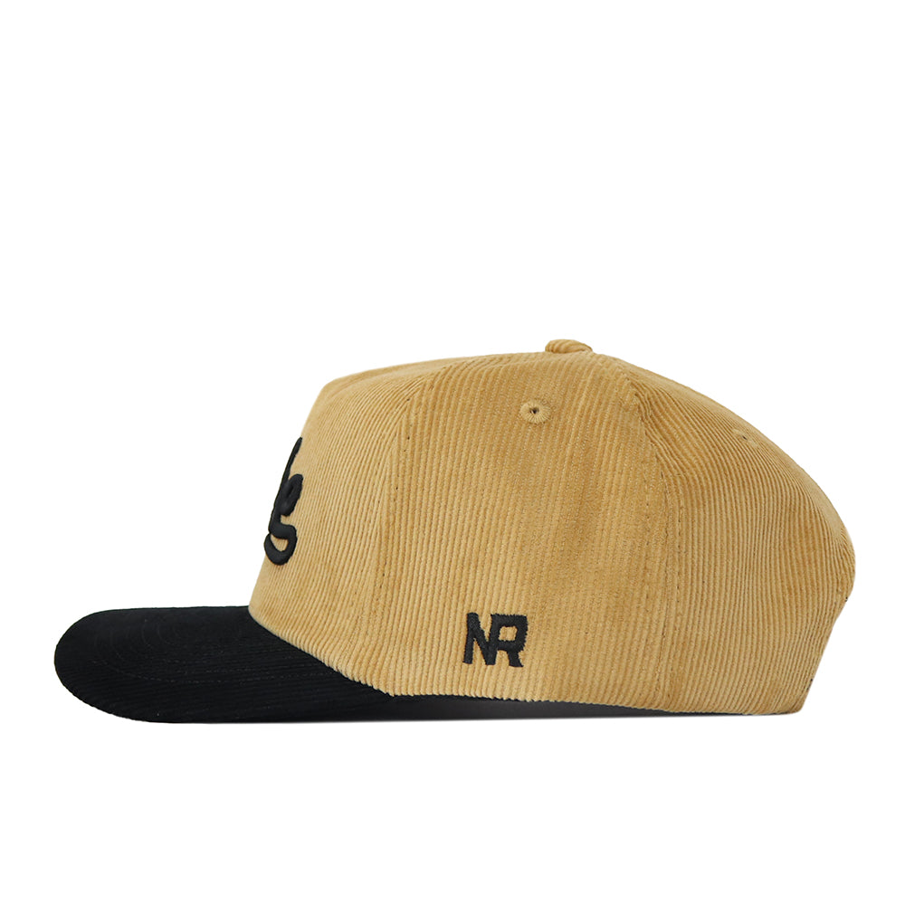 Introducing the Wake Forest 2 Tone Gold Rush Hat by No Rivals—a tan corduroy snapback cap with a black brim, featuring an unstructured fit and embroidered NR initials on the side.