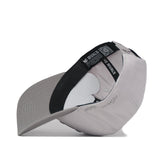The Nebraska Graphite Hat by No Rivals, flipped inside out, reveals its black inner band labeled NO RIVALS and the white interior support structure.