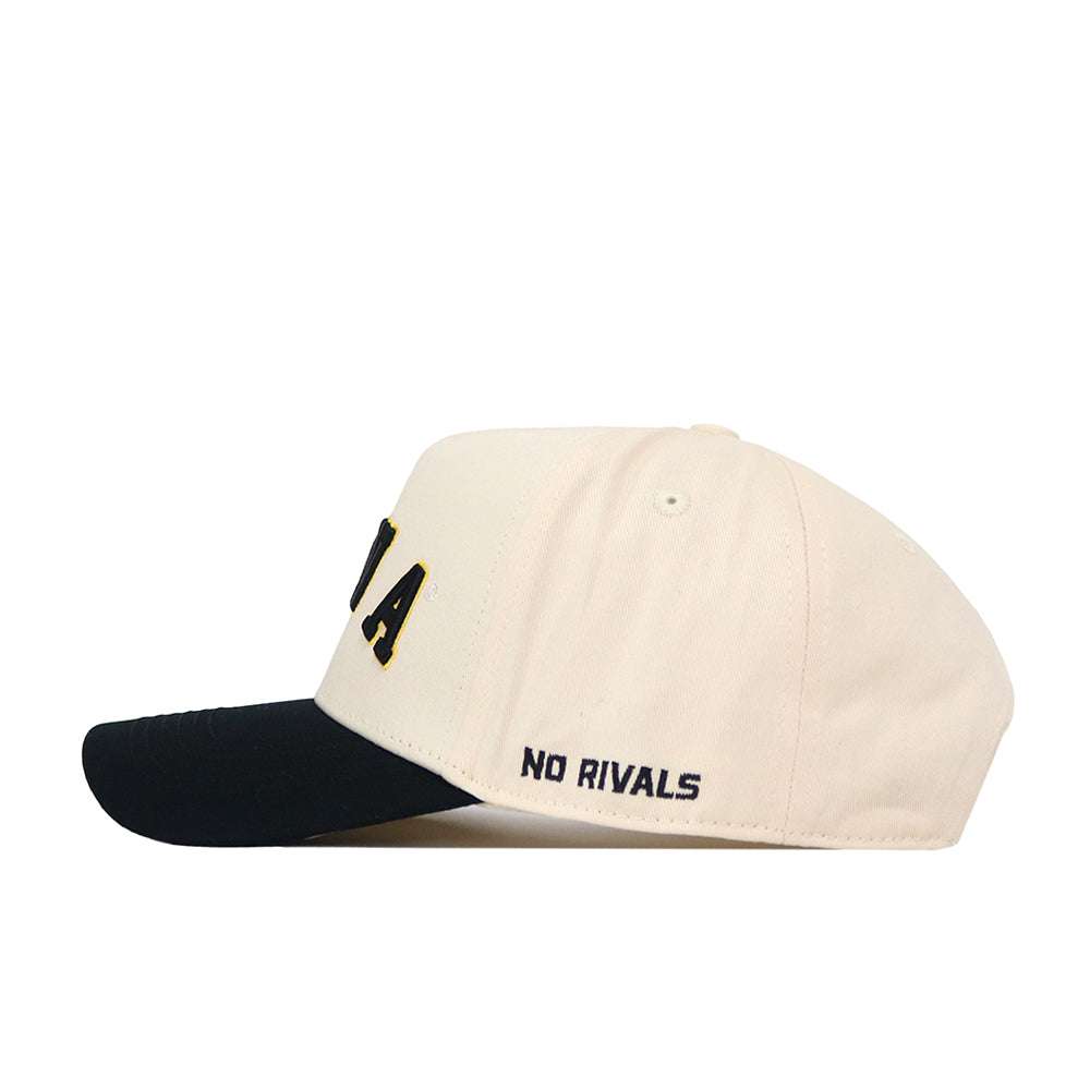 The Right Side Up Iowa Hat - Classic by No Rivals features a cream and black snapback design seen from the side, with “NO RIVALS” embroidered in black above the brim on the left. The front displays the letters “A” and part of an “L,” making this hat a standout choice for your gameday fit.