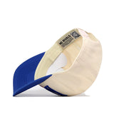 The Kansas Jayhawks Stride Hat by No Rivals is a cream and blue snapback, showcased inside out to reveal an inner tag with “NO RIVALS” and a QR code. Featuring a blue brim and cream-colored crown, this officially licensed cap is accented with subtle embroidered logos.