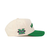 Introducing the Right Side Up Marshall Hat by No Rivals—an ivory baseball cap featuring a green brim and a structured fit for lasting style and comfort. On the side, an embroidered green M logo with "THE HERD" text highlights meticulous detailing, while partially visible "HERD" text appears in green on the front.