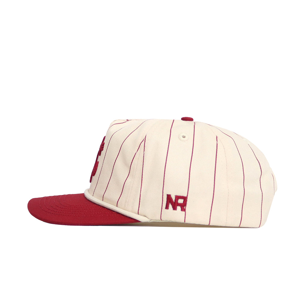 The No Rivals Washington State Pinstripe Hat features a cream base with thin red pinstripes, a red bill, and an embroidered red "NR" logo above the brim. Made of high-quality cotton with a snapback closure for an adjustable fit.