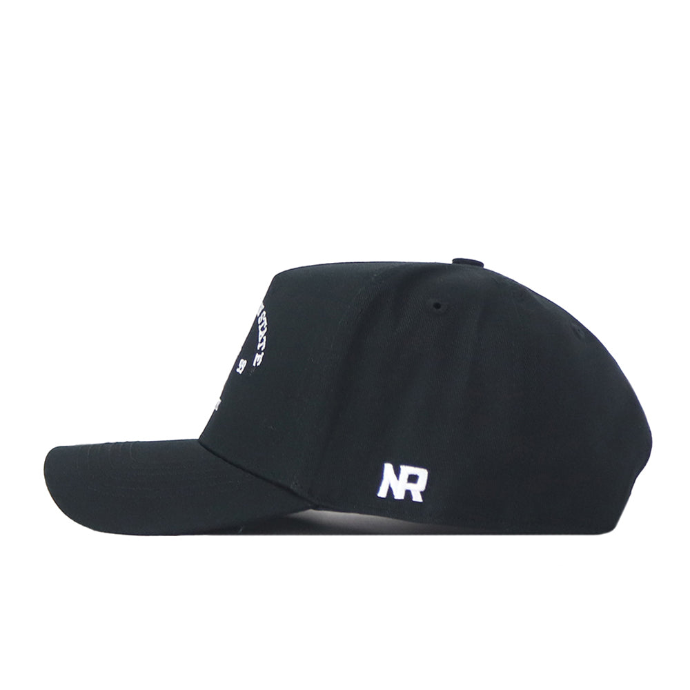 A side view of the App State Outlaw Hat - Black by No Rivals, showcasing a white embroidered "NR" logo near the back above the adjustable strap. Made from high-quality cotton, this cap features a convenient snapback closure for a comfortable fit.