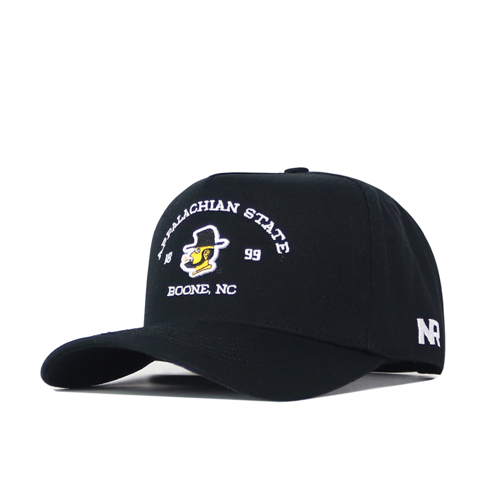 The App State Outlaw Hat - Black by No Rivals is a black baseball cap with a curved brim, crafted from high-quality cotton. It features an embroidered Appalachian State logo, a yellow mascot face, and "Appalachian State, Boone, NC" text on the front. The side showcases white "NR" letters for the No Rivals brand, and it includes a convenient snapback adjustment for a comfortable fit.