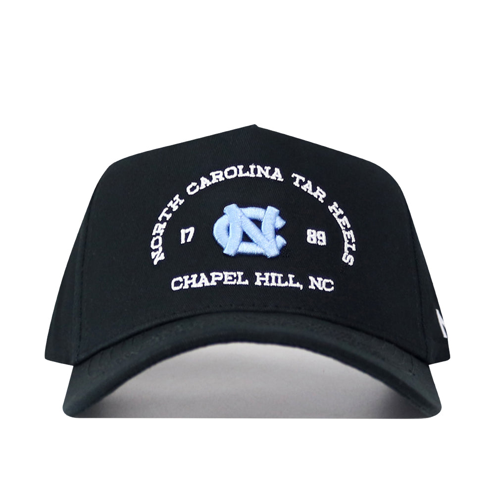 The No Rivals UNC Outlaw Hat - Black features "North Carolina Tar Heels Chapel Hill, NC 1789" and the UNC logo embroidered in light blue and white on the front, offering a structured fit and an adjustable snap back closure for customizable comfort.