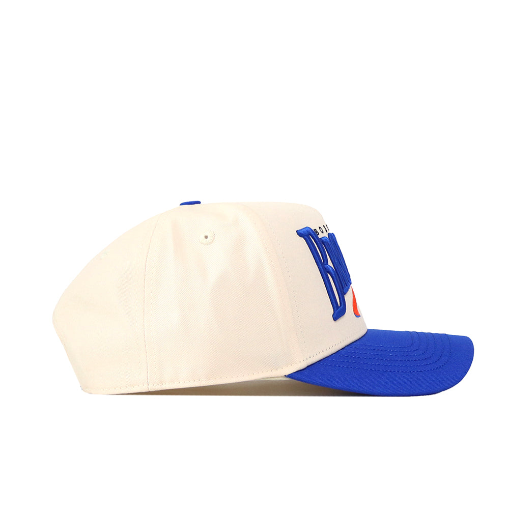 Side view of an officially licensed No Rivals Boise State Broncos Stride Hat, featuring a white crown, bright blue flat brim, and blue embroidered logos on the front.