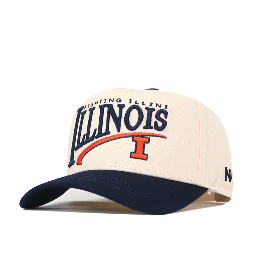 Complete your gameday look with the Illinois Fighting Illini Stride Hat by No Rivals—a beige and navy snapback featuring Illinois and Fighting Illini embroidered logos in blue and orange on the front, plus a bold letter "I" beneath the text.