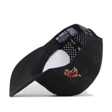 Show off your style with the Texas State Golf Hat in black by No Rivals—a classic baseball cap turned sideways, featuring bold embroidered red and gold flame graphics on the side and perforated holes on the back panel. The inside is finished with a signature NO RIVALS label, while an adjustable snapback closure offers a golf hat-inspired fit.