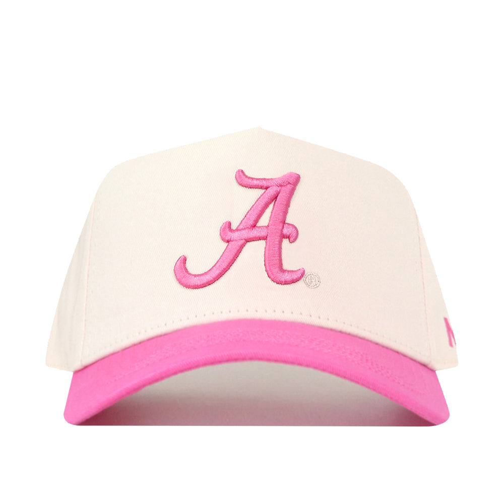 The Alabama Pink Out Hat by No Rivals is a white snapback with a pink brim and an embroidered letter A, shown on a white background—an officially licensed breast cancer hat.