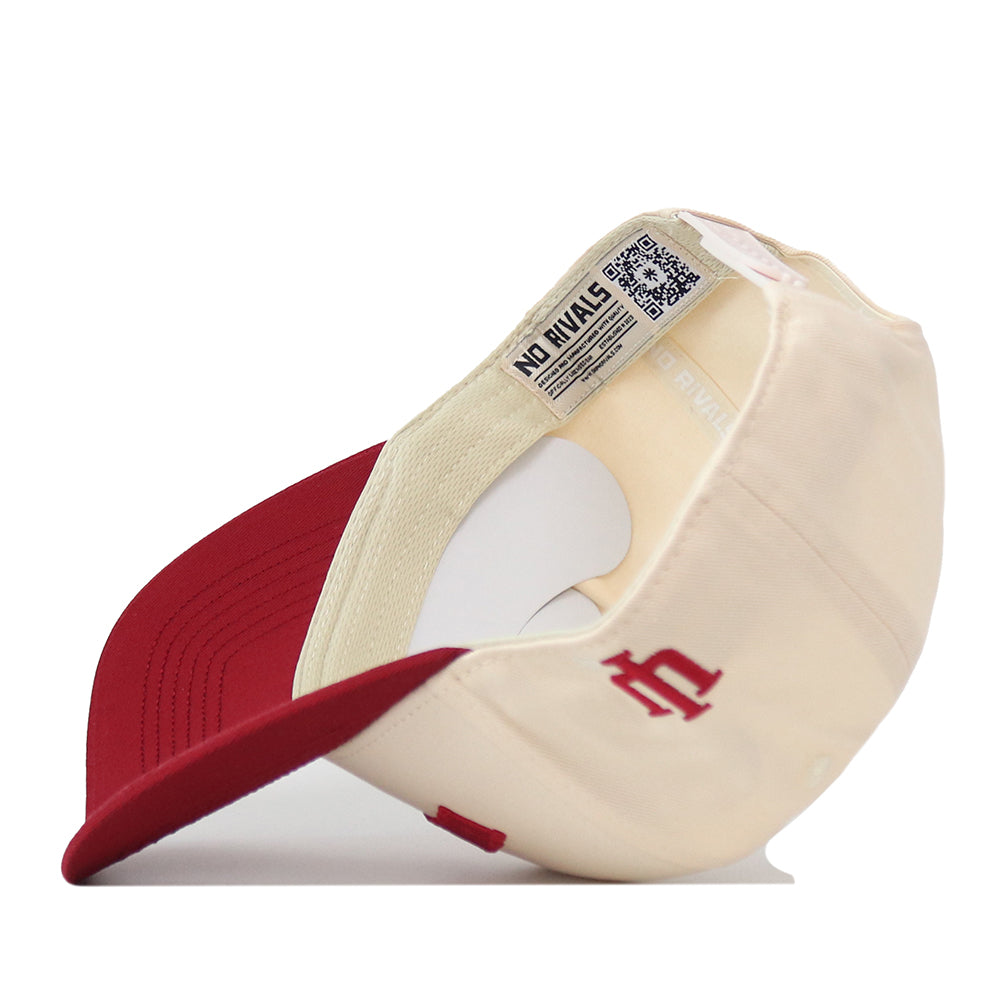 A cream and red Right Side Up Hoosiers Hat by No Rivals, turned inside out to display a tag with the brand’s name and a maroon embroidered logo on the side.
