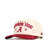 The Alabama Rally Hat by No Rivals is a beige and red snapback with the Alabama Crimson Tide logo—featuring a large A and 1831—embroidered on the front, NR stitched on the side, and a subtly patterned red brim. Made from high quality cotton.