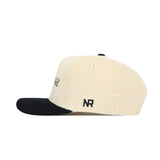 The No Rivals Tennessee Traditions Hat is a cream corduroy snapback with a black brim, side NR initials, top vent holes, and a structured fit, shown in a side view.