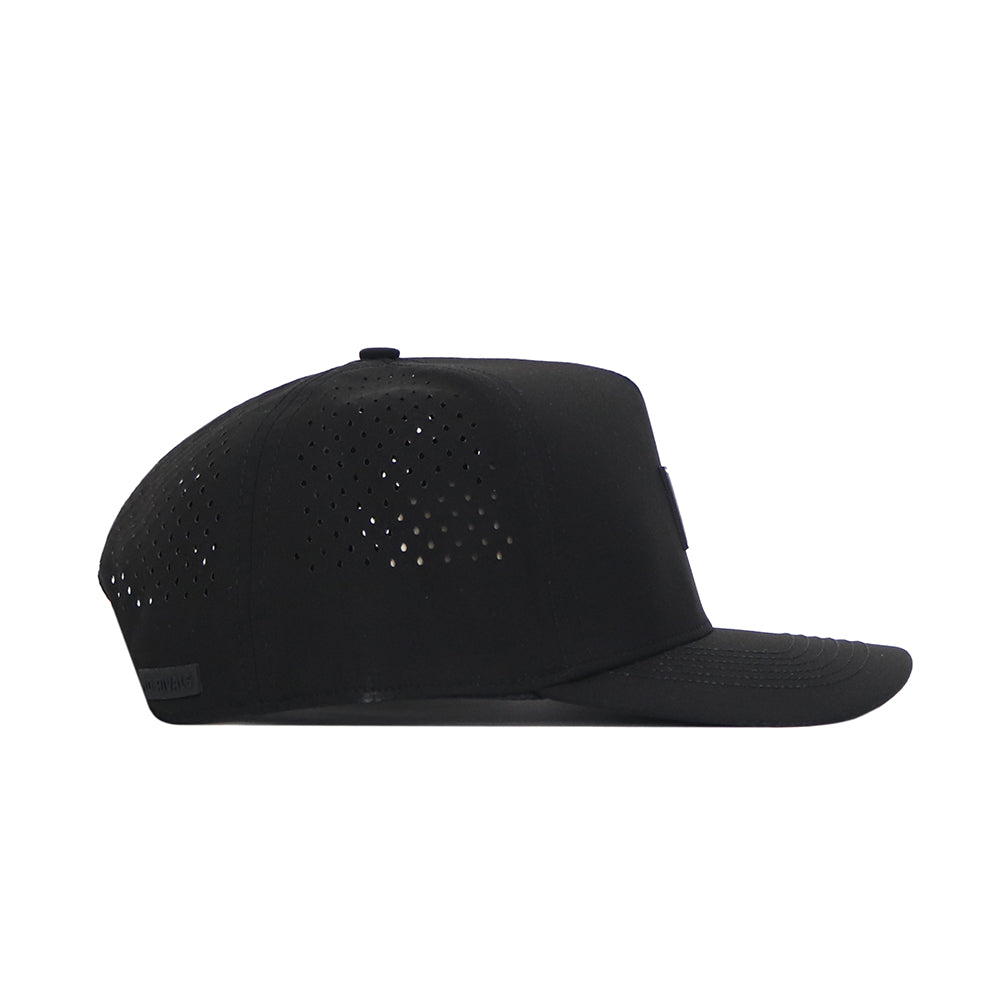 The Texas A&M Trainer Hat by No Rivals is a black snapback with a flat brim and side ventilation holes, displayed in side profile against a white background.