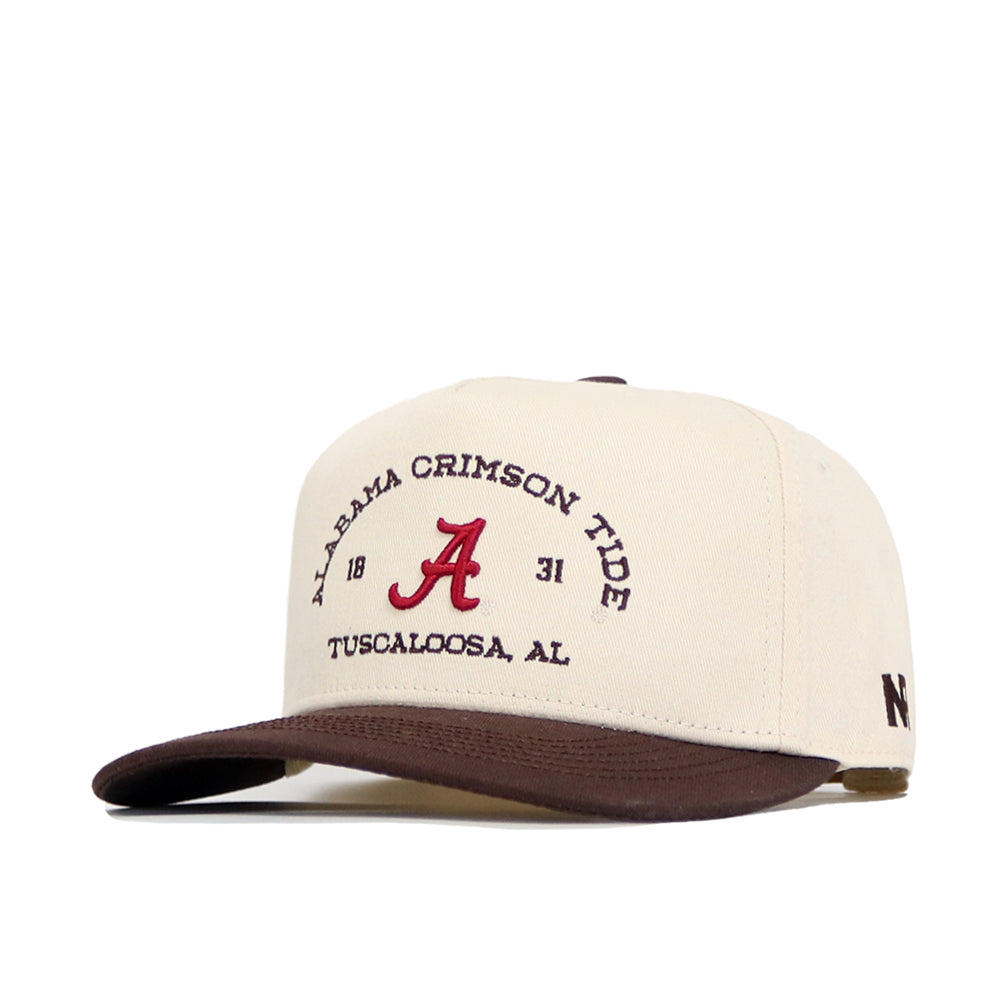 The No Rivals Alabama Outlaw Hat - Classic is a cream and brown cap with a bold red A, “Alabama Crimson Tide,” “1831,” and “Tuscaloosa, AL” embroidered. It features a structured fit and pre-curved brim for comfort.