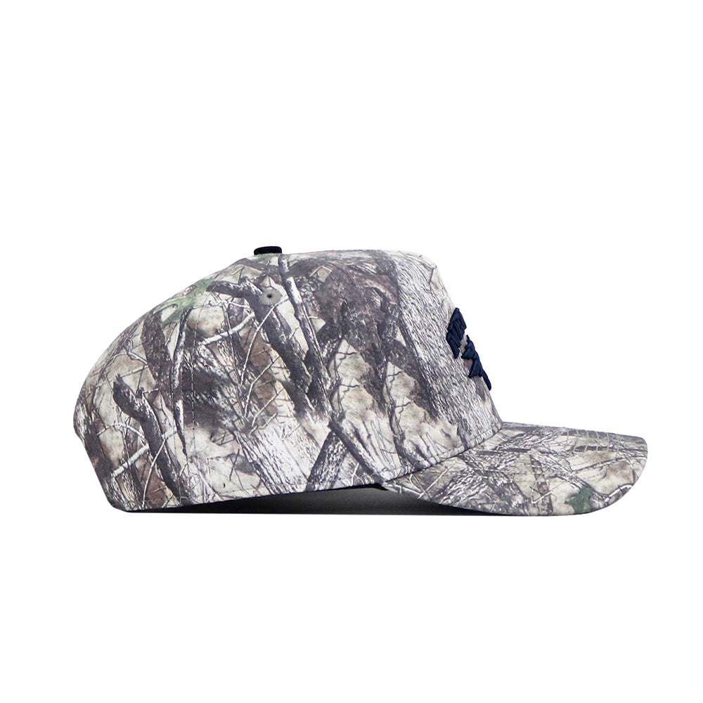 The No Rivals Nevada Wolfpack Outland Hat is a structured fit, flat-brim baseball cap with a brown, green, and beige camouflage pattern and an adjustable snap back for comfort.