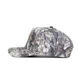 A side view of the No Rivals NDSU Outland Hat—a camouflage snapback with a flat brim, yellow logo on the front, white NB initials on the side, and a structured fit for style and comfort.
