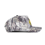 Side view of the No Rivals NDSU Outland Hat, featuring a gray and brown camo snapback design with a small yellow graphic on the front, made from high-quality cotton for a structured fit.